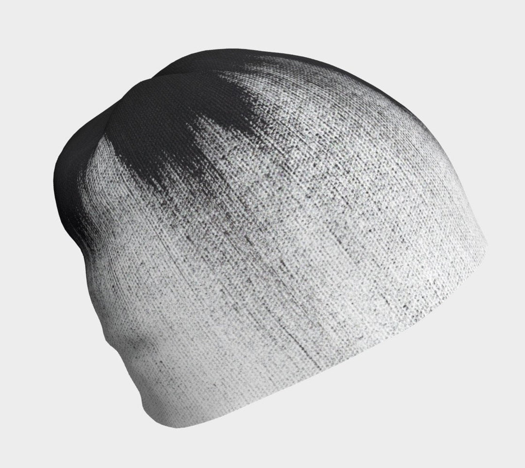 Motif abstrait noir et blanc de coups de pinceau sur une tuque grise.