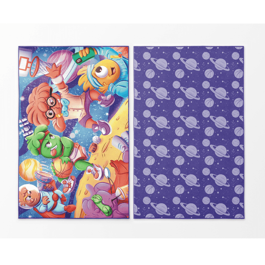 Reversible Cosmic Slam beach towel showing a vibrant space basketball scene on one side and a purple planet pattern on the other.