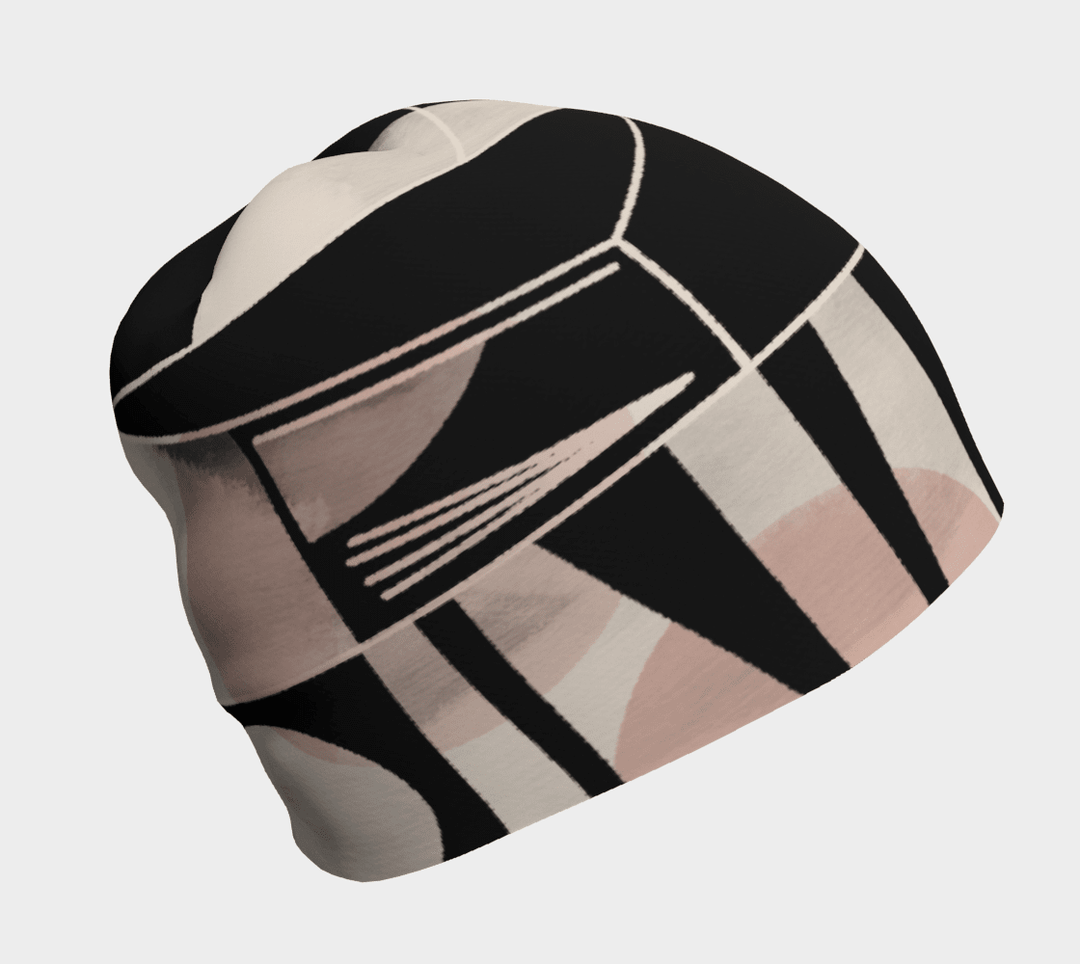 Une tuque pour femme avec un motif abstrait géométrique noir, rose, beige et blanc.