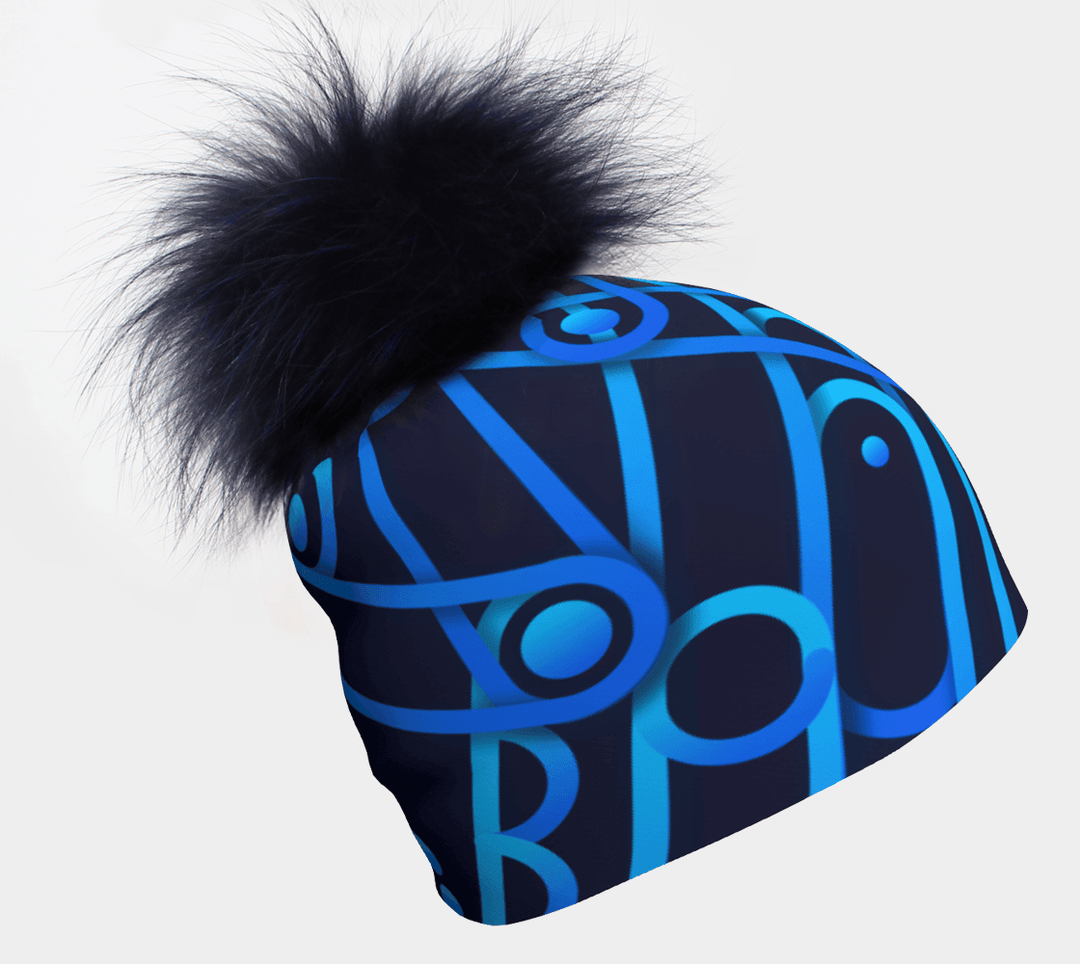Tuque Bleu Mécanique avec un pompon bleu foncé, ornée d'un motif abstrait répété d'engrenages bleus.