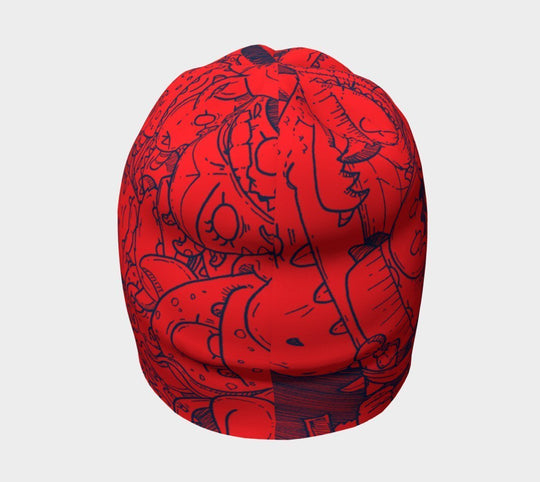 Tuque rouge avec des gribouillis de monstres bleus, vue de côté.