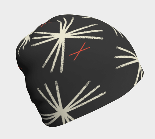 Tuque MotifX Noire sur fond sombre, avec un motif abstrait en forme de soleil blanc et des croix rouges.