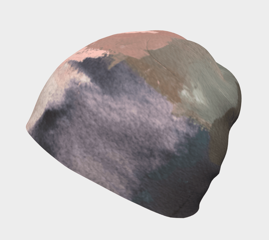 Grey and muted pink abstract brushstrokes on a beanie, shown from the side.