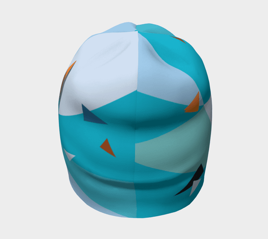 Vue de face de la tuque Hirondelle, mettant en valeur le motif géométrique abstrait dans des tons de bleu et d&