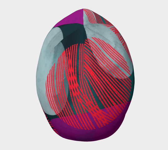Vue de dessus de la tuque Pois Bleu-Vert avec son design graphique distinctif bleu-vert, magenta et rouge.