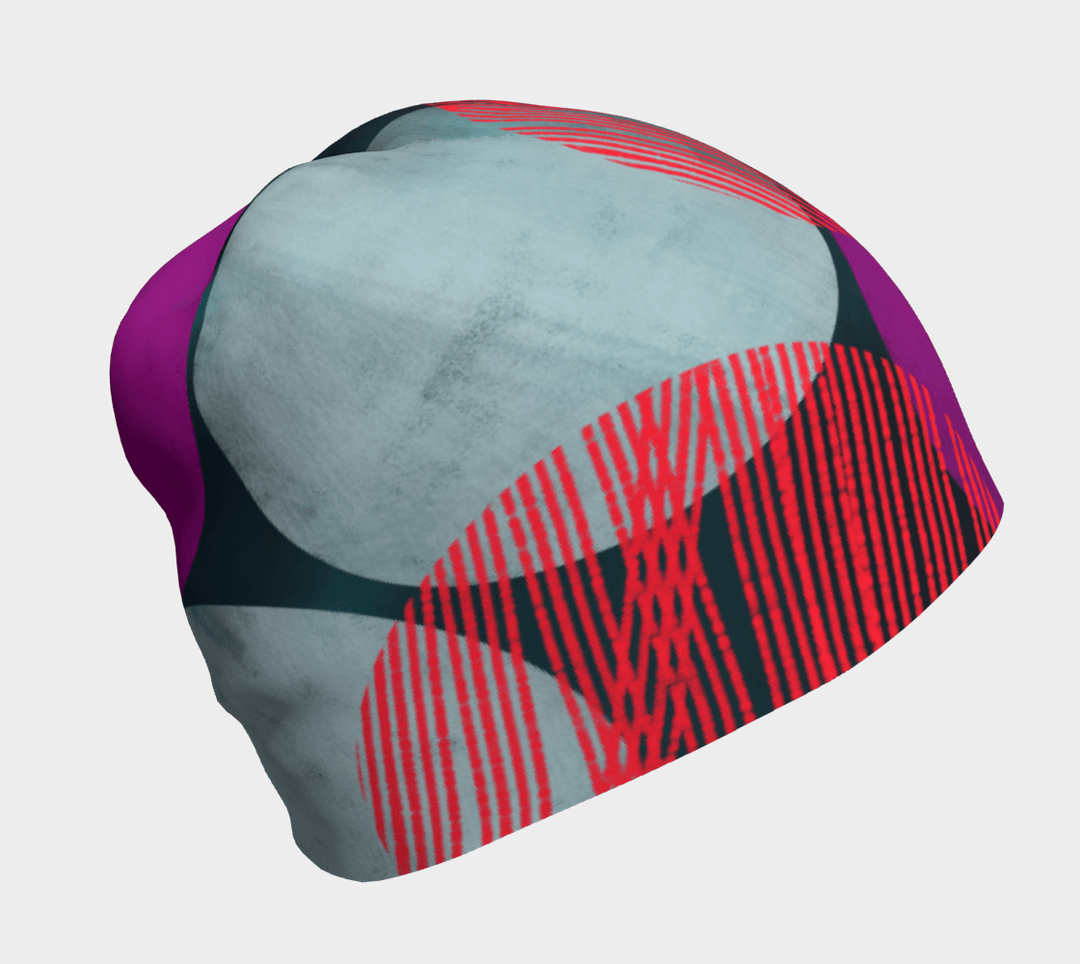 Vue de face d'une tuque Pois Bleu-Vert avec des motifs circulaires abstraits en bleu-vert, magenta et rouge.