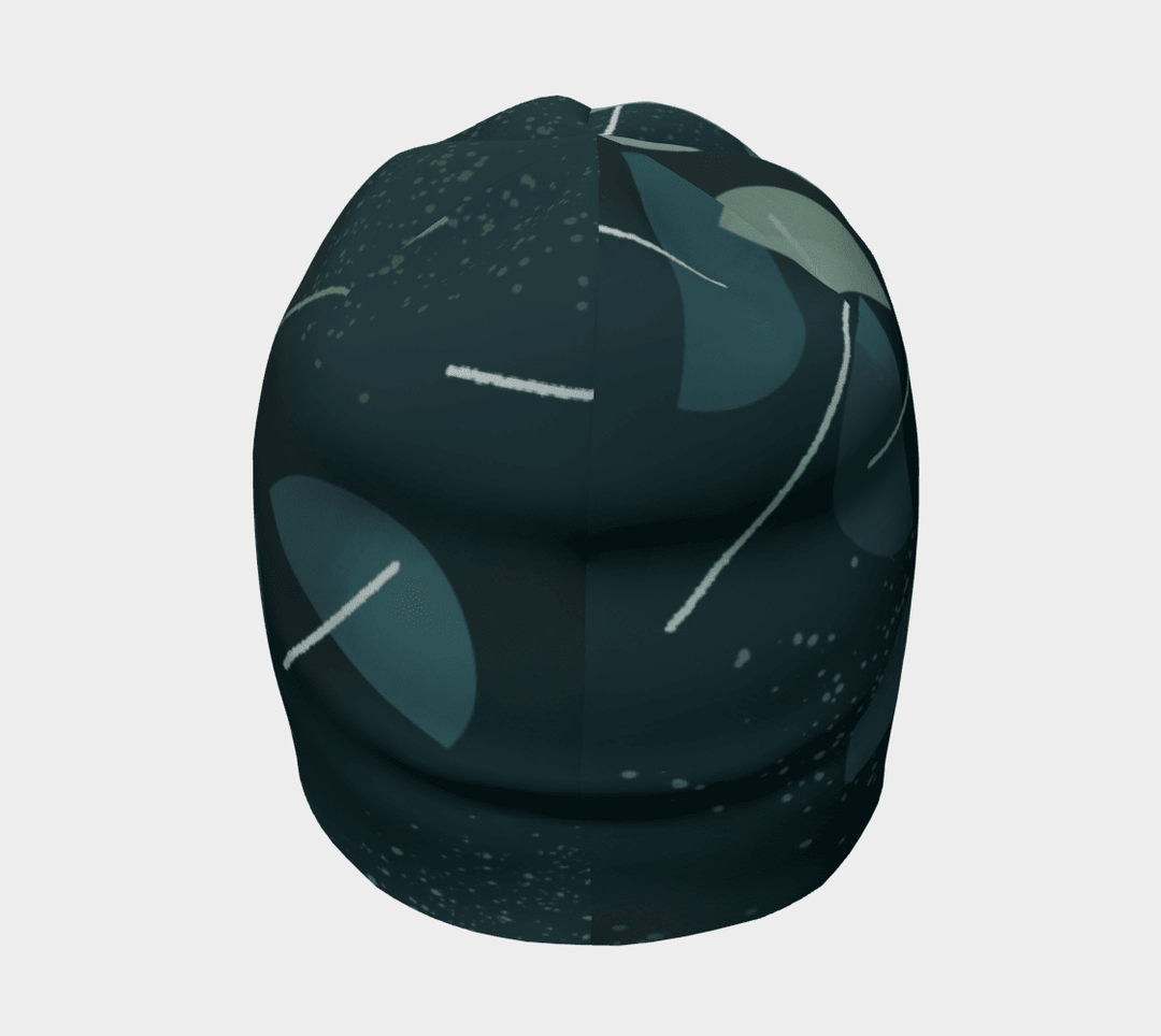 Vue latérale de la tuque à motif abstrait bleu sarcelle, soulignant sa couronne arrondie et son design.