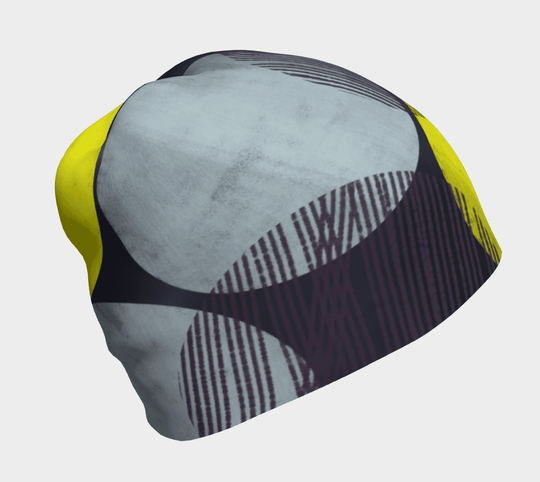 Tuque à Motifs Jaunes pour Femme, vue de dessus, montrant le motif abstrait jaune, gris et bleu foncé.