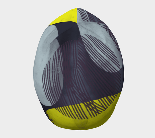 Gros plan de la Tuque à Motifs Jaunes, illustrant le design abstrait vibrant jaune et gris.