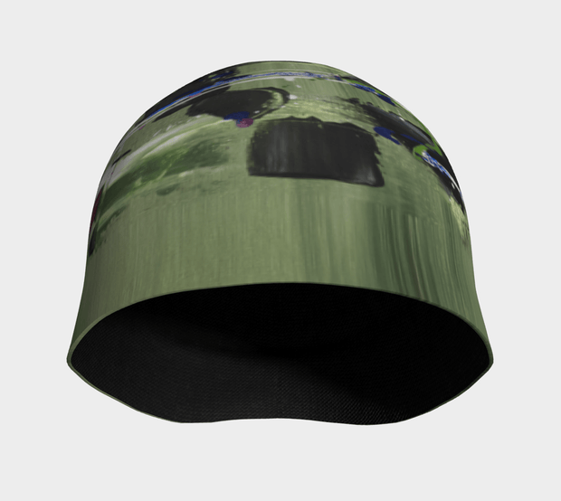 Front view of the black, blue, green 4 seasons tuque that matches with every color jacket possible !