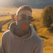 Men enjoying the outdoors wearing the black and gray bandana Movement orange with a light grey sweatshirt.