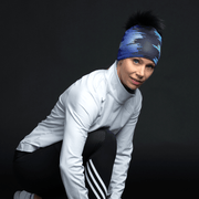 Woman rearing the Black War Pom beanie when training. 