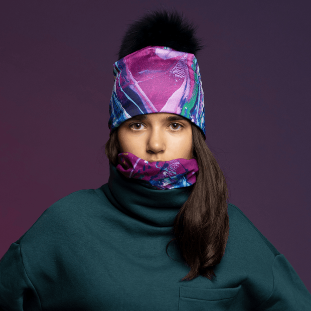 Teenager facing the camera wearing Hope bamboo beanie with pompom for Lalita's Art Shop