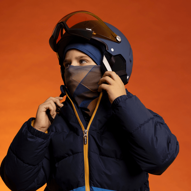 Young boy wearing the Navy and Gold Sunrise Fleece tube by Zaire for the Lalita's Art Shop AW24-25 Collection